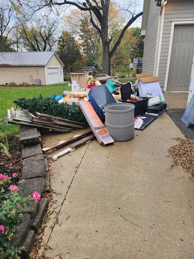 Dumpster being loaded with debris for Roofing Dumpster Rental in North Middleton